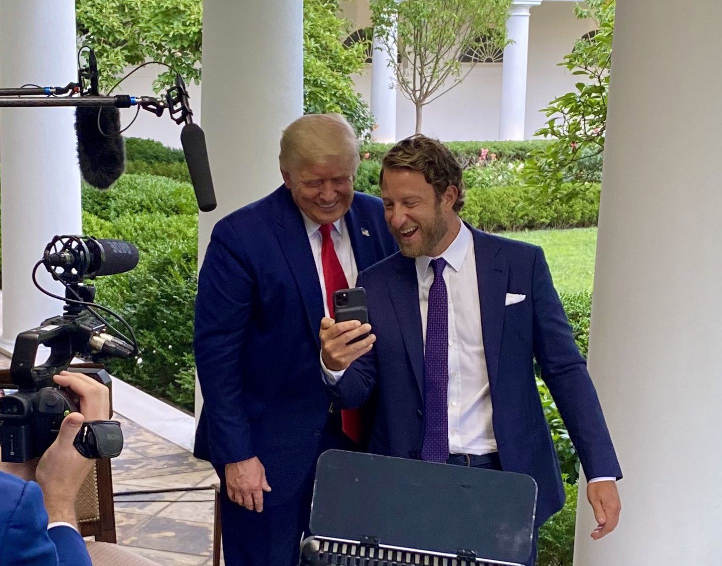 Dave Portnoy shows his phone to President Donald Trump